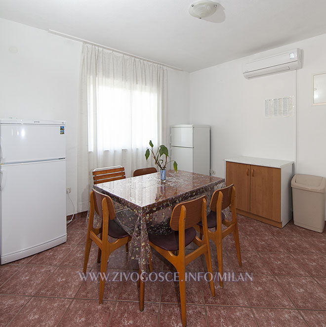 dining room with 2 large refrigerators